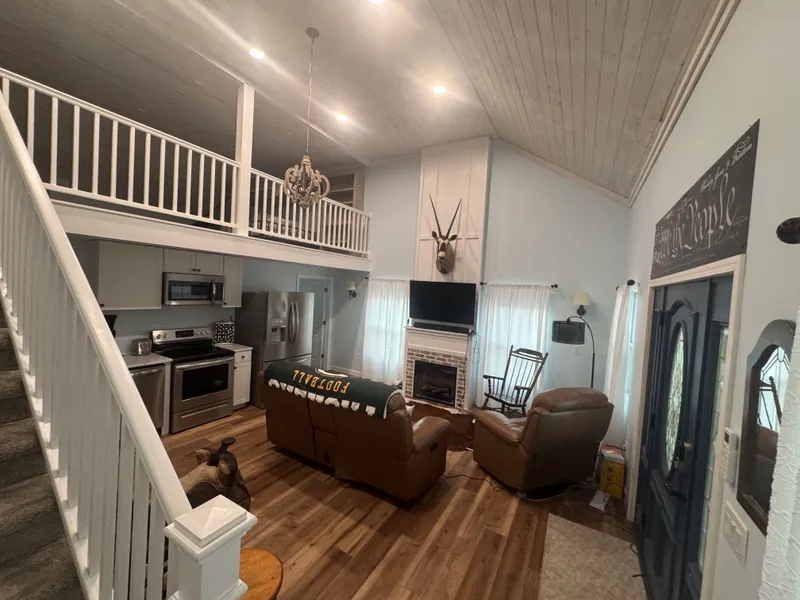 Open kitchen, living room and loft inside the lodge